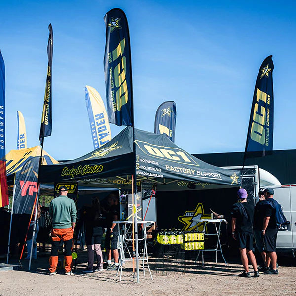 OC1 Factory Support tent with flags in the paddock